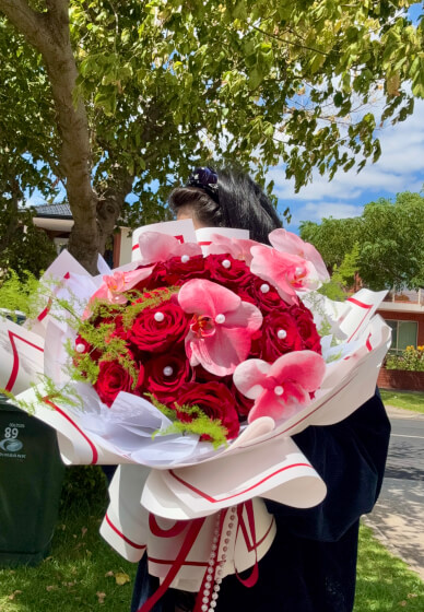 30 Red Roses Mixed Phalaenopsis Orchids Twisted Arranging