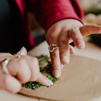 Arrange flowers and foliage