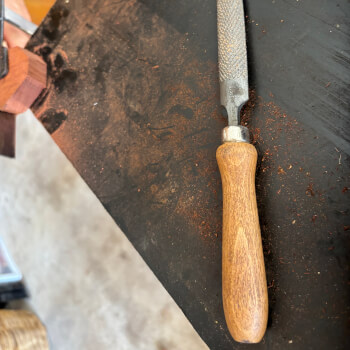 Starting to shape your meditation pebble with a rasp