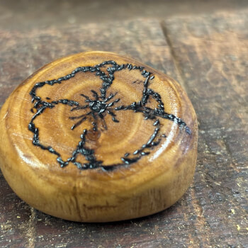 Wood burning a design onto your pebble 