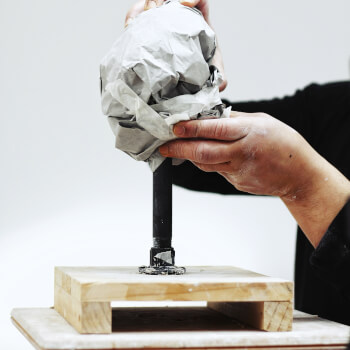 Secure the paper with masking tape.