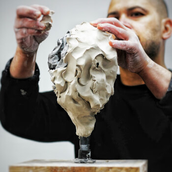 Wrap the paper in clay.