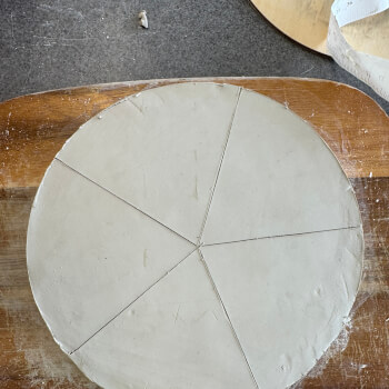 Shape in into a large round base 