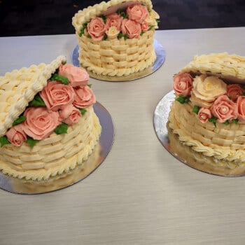 Half open basket cake with roses, buds and leaves