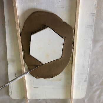 Cut the clay to a template