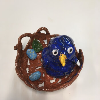 Bird in a nest sculpture