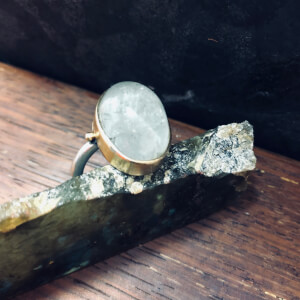 25 ct aquamarine cab ring in sterling and 14ct gold. 