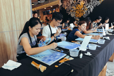 Students displaying their final artwork 