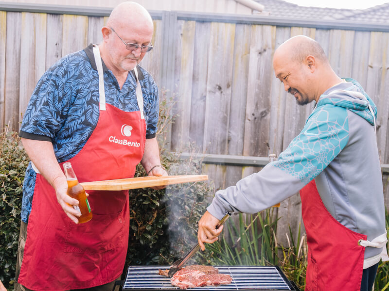 A dad enjoys learning to cook on the BBQ