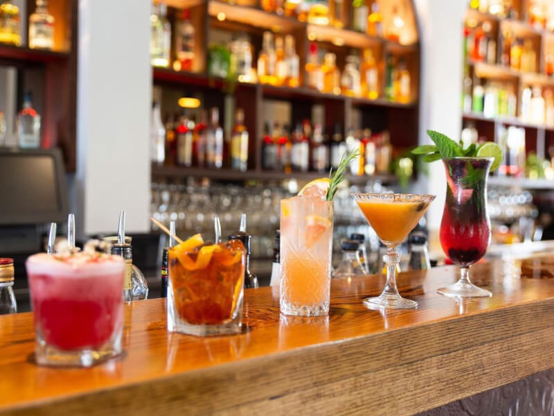An array of cocktails on a bar