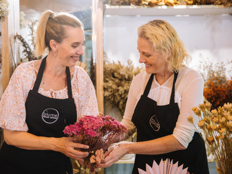 two women at dried flower arrangement class