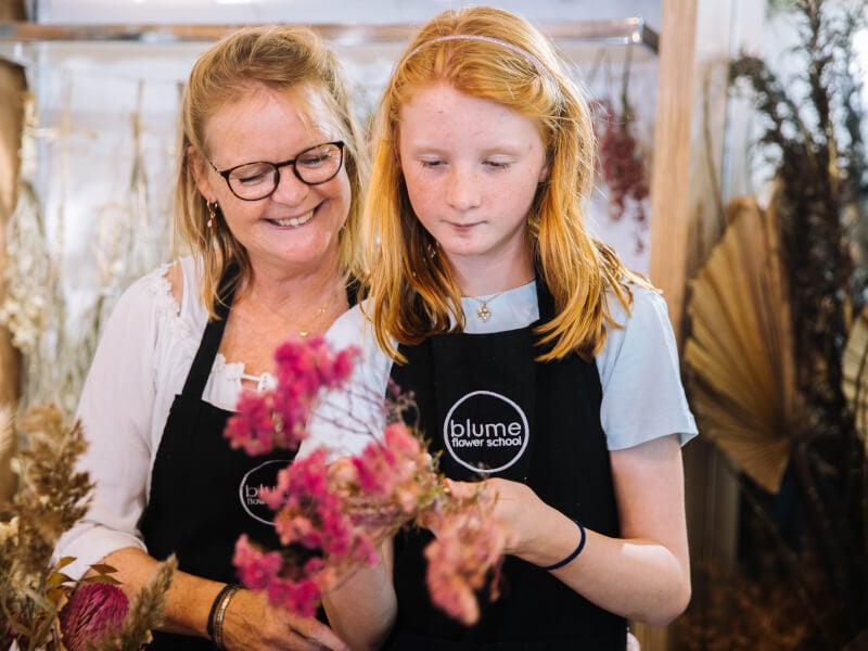 aunty and niece arranging dried flowers