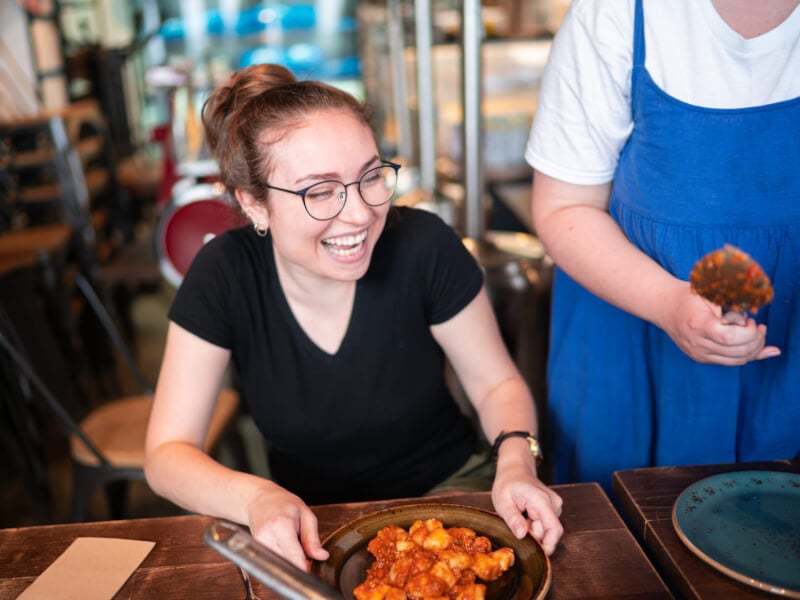 woman smiling with handmade gnocchi