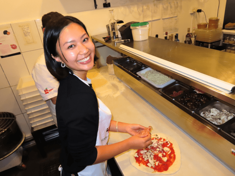 Woman making pizza