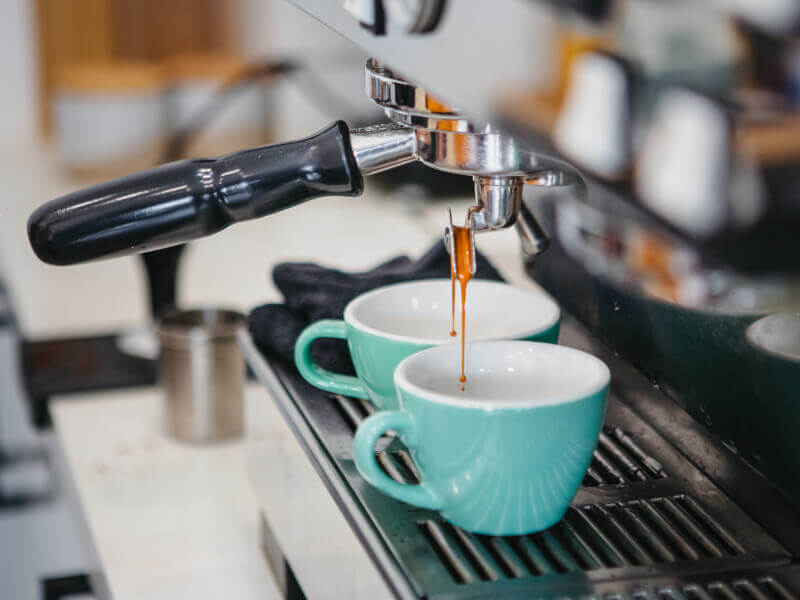 Espresso being extracted in a coffee machine