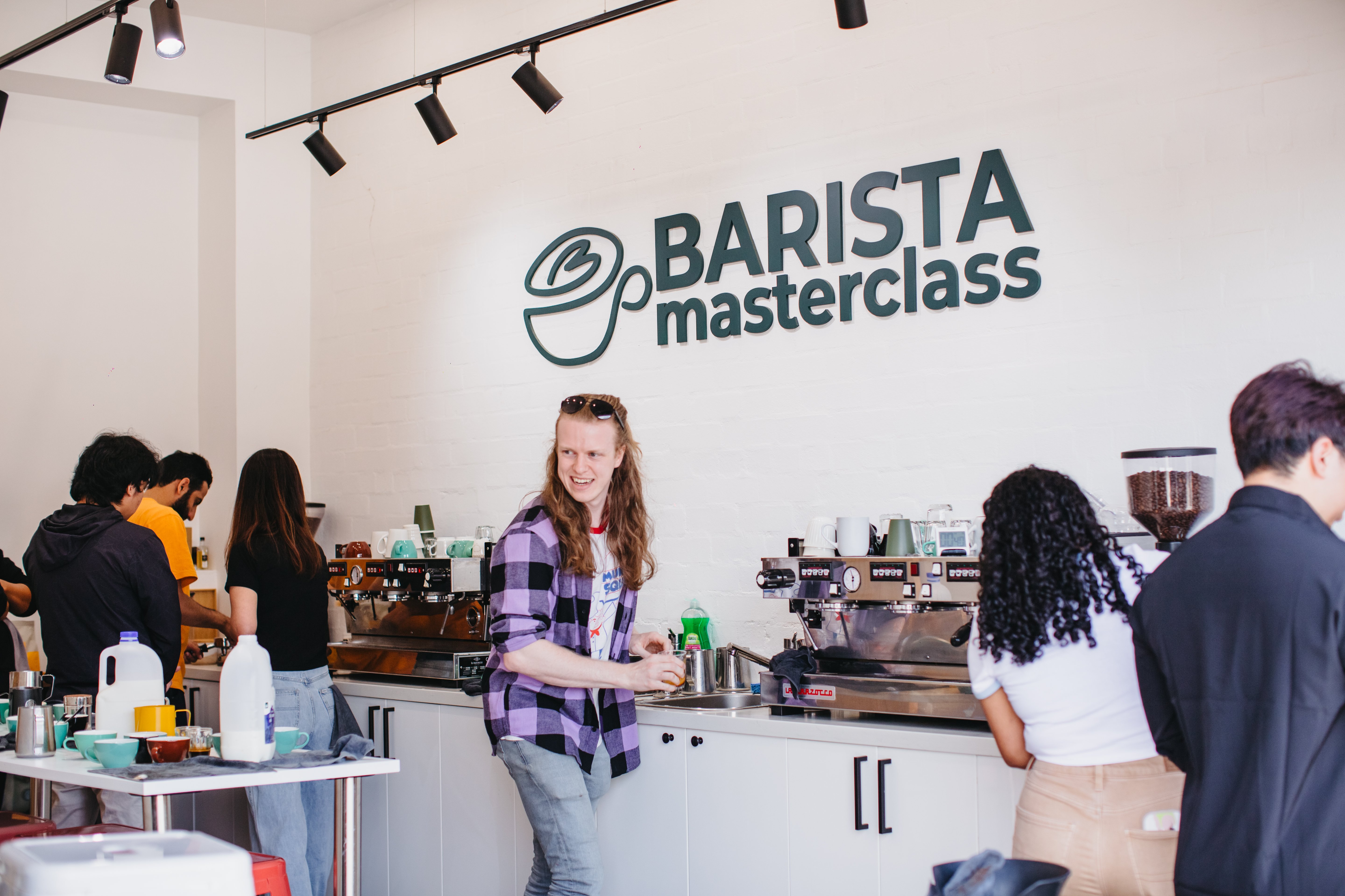 Teacher and students at a Barista Masterclass' coffee class