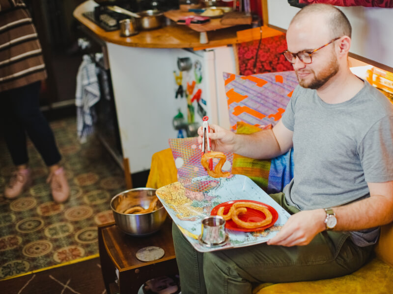 Man picking up a churro
