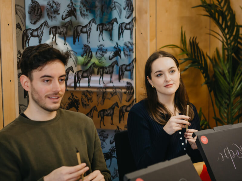 People at a calligraphy class