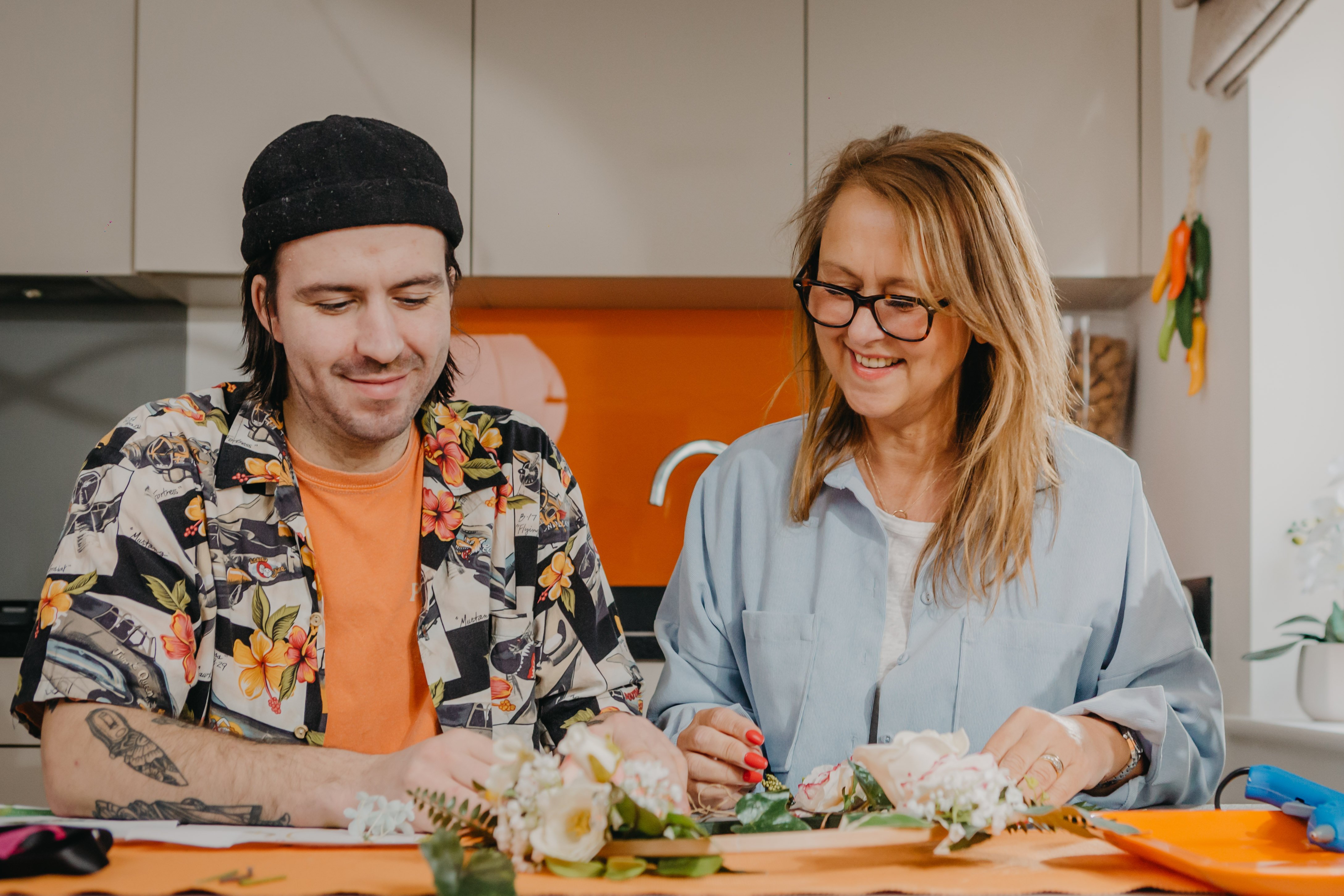 Mother and son making a dried flower crown