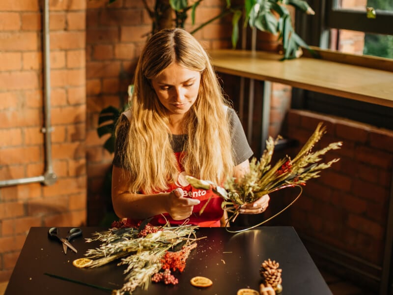 Woman making Christmas wreath