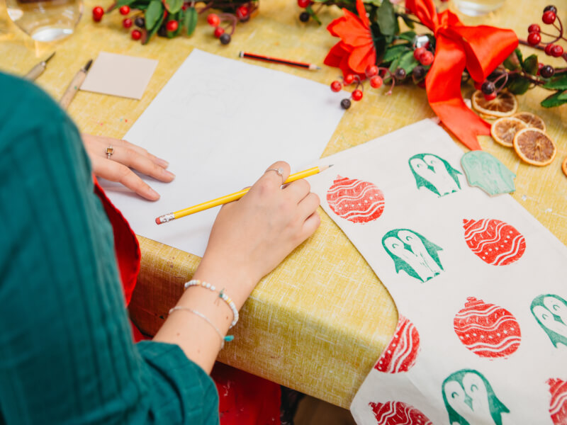 Person drawing in a Christmas decorations class
