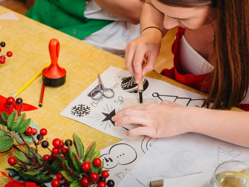 Close-up of woman making a linocut print design