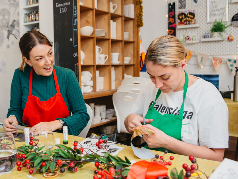 Women making Christmas decorations