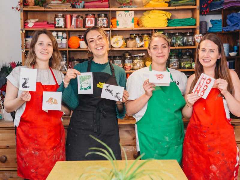 Group of women showing off their handmade cards