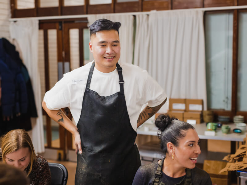 Man standing in a pottery class