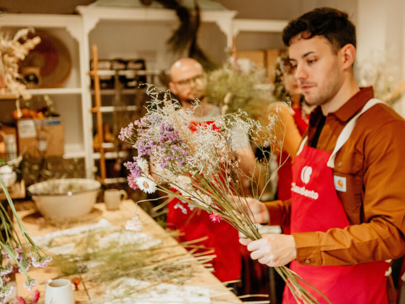 man at fun flower arranging class