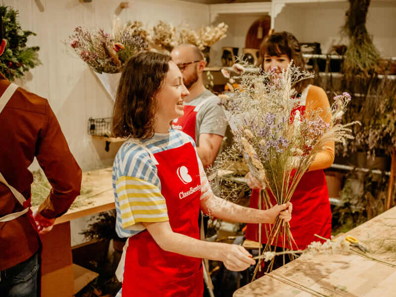 Woman making a dried flower arrangement