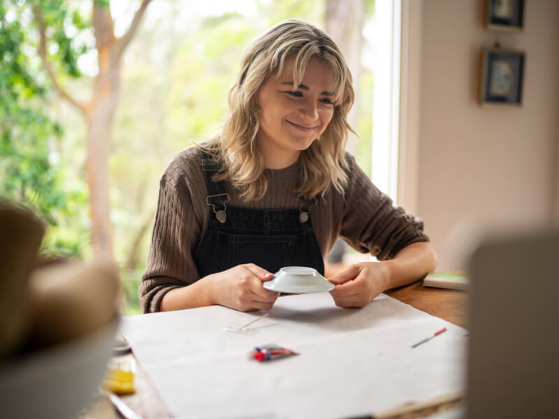 woman smiling at online pottery class