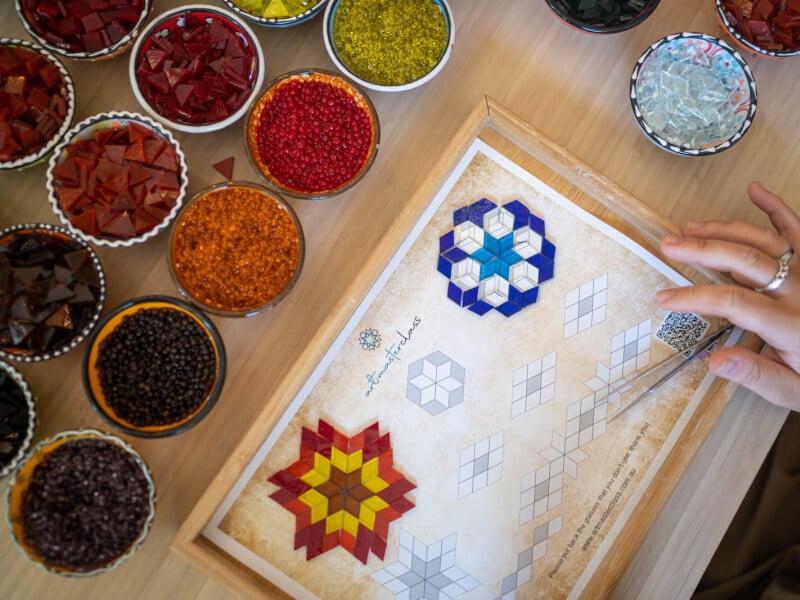 Bird's eye view of mosaic glass pieces and template