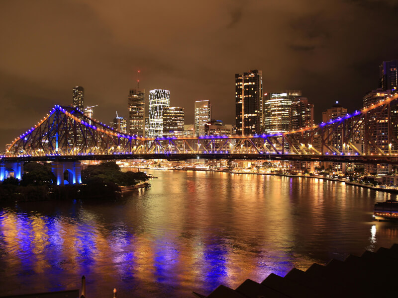 Brisbane city at night with water in foreground