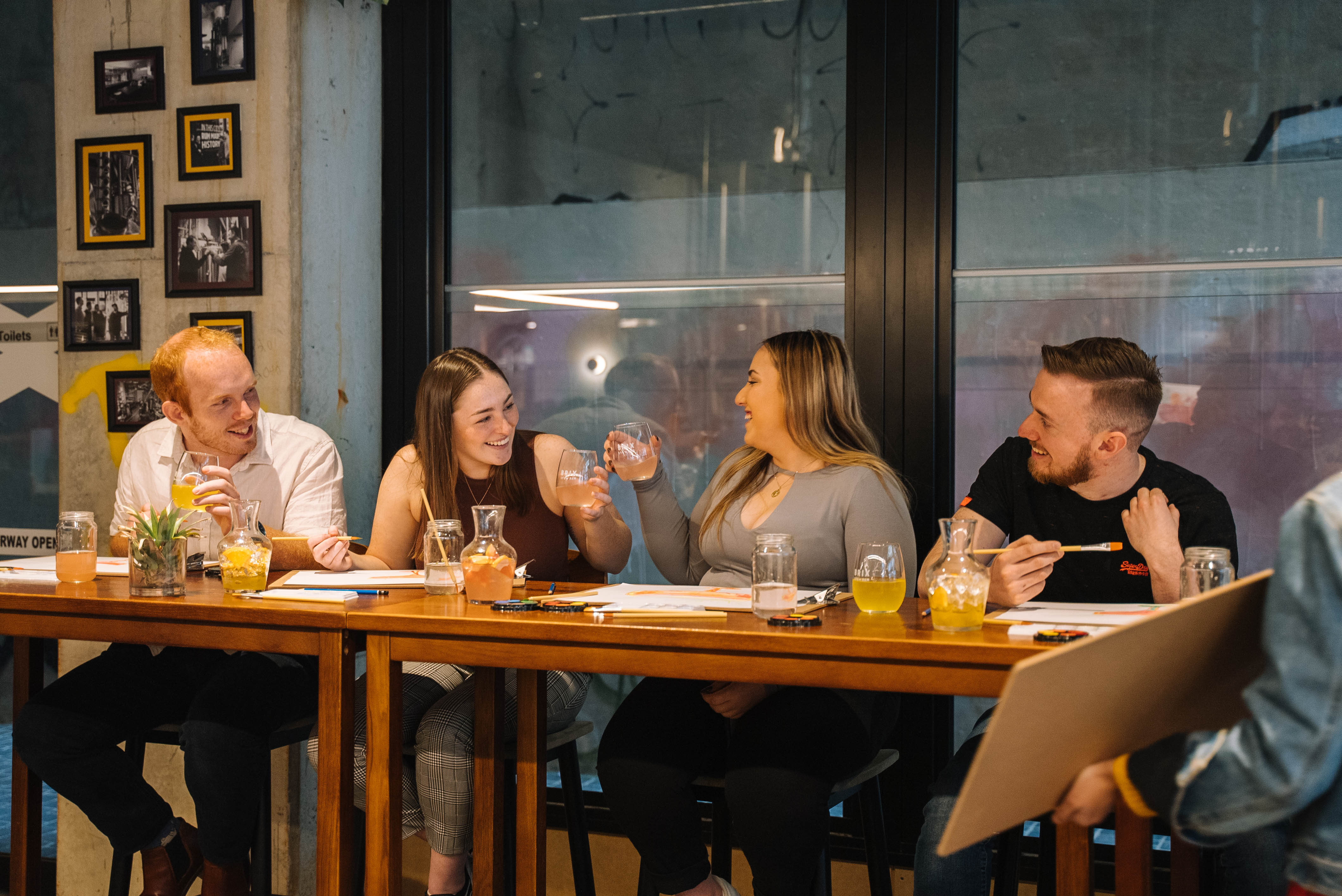Group of people enjoying a paint and sip class