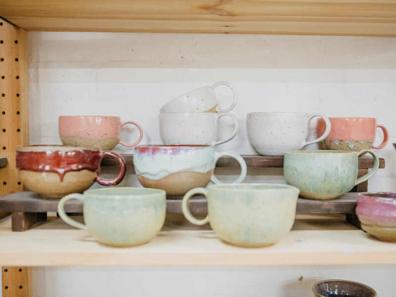 A stack of handmade ceramic cups