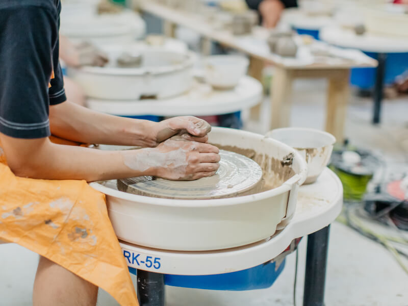 Close-up of man wheel throwing