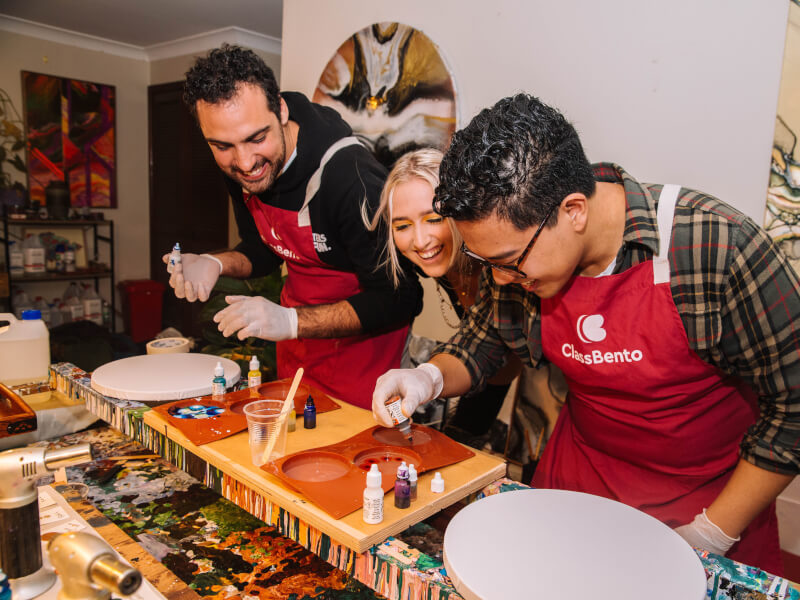 two men at paint pouring class
