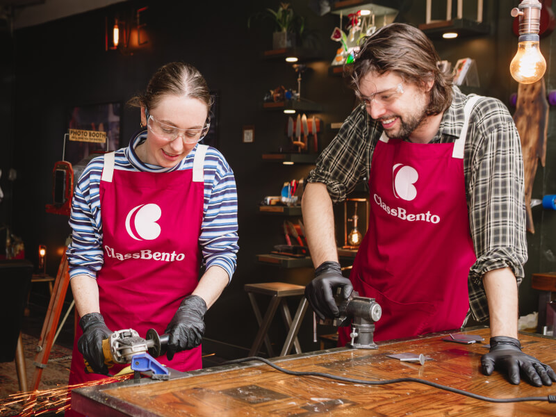 Couple smiling and welding