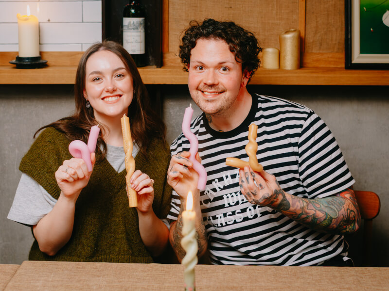 People holding up their finished candles