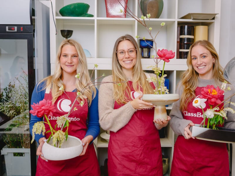 Women showing off their Ikebana arrangements
