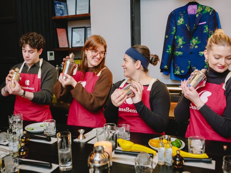 Colleagues shaking cocktails