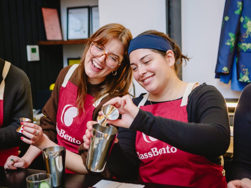 Women enjoying making cocktails
