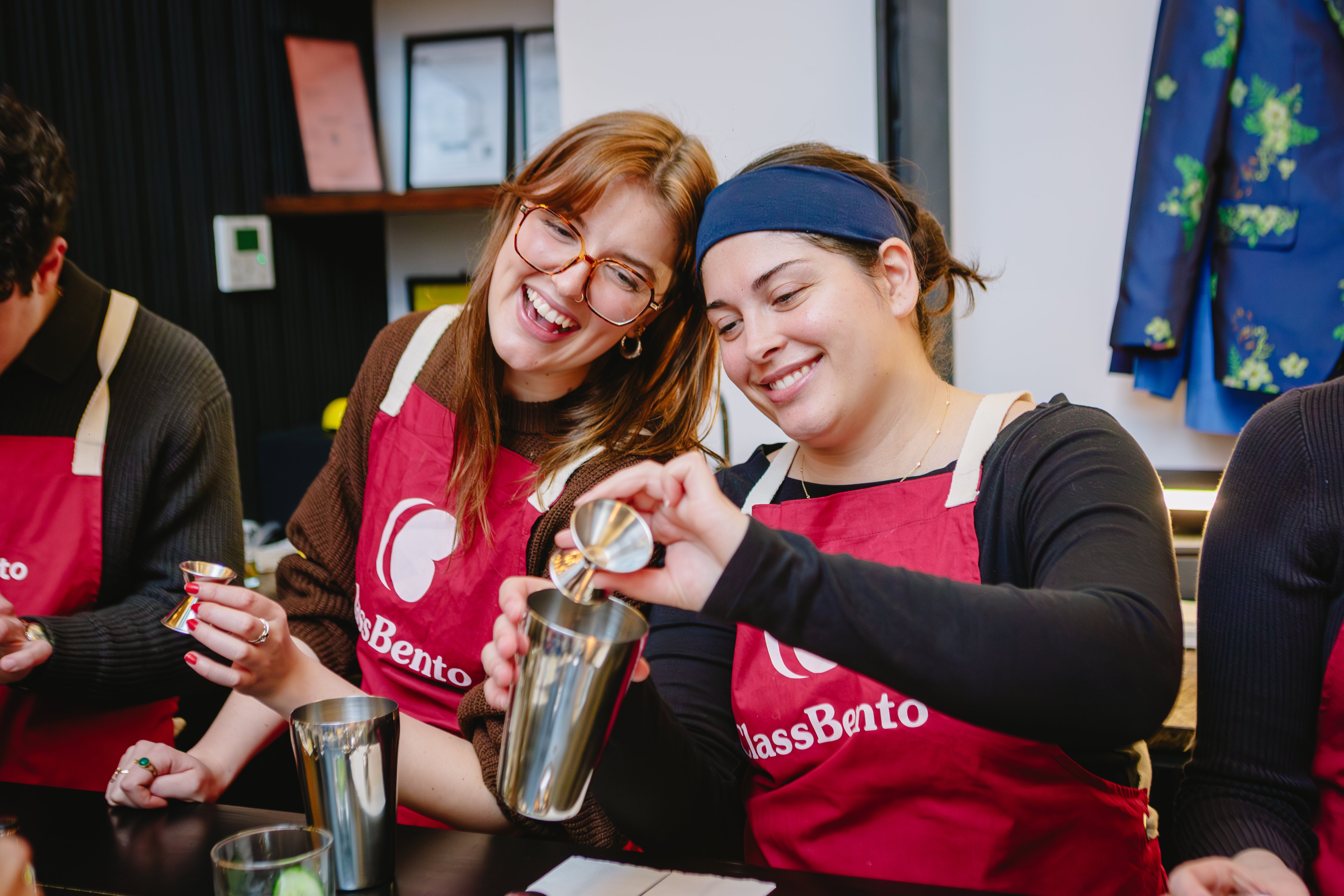 Two women enjoying a cocktail making class