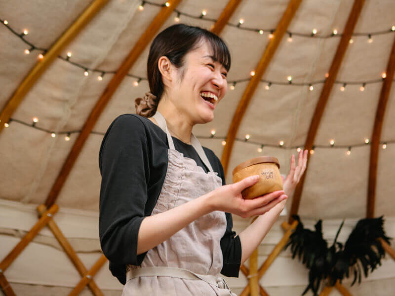 smiling woman taking a workshop