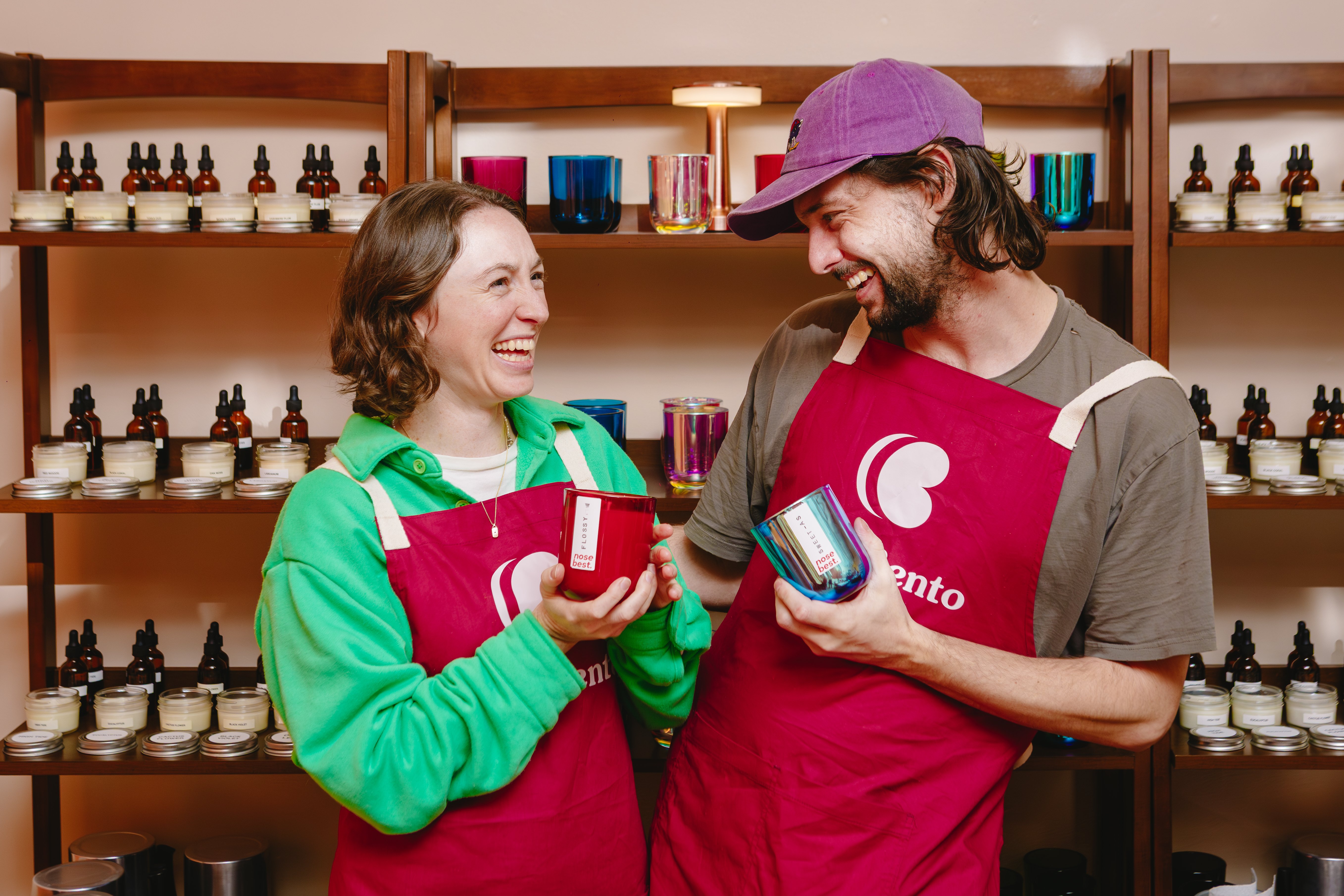 Couple holding their candles and smiling