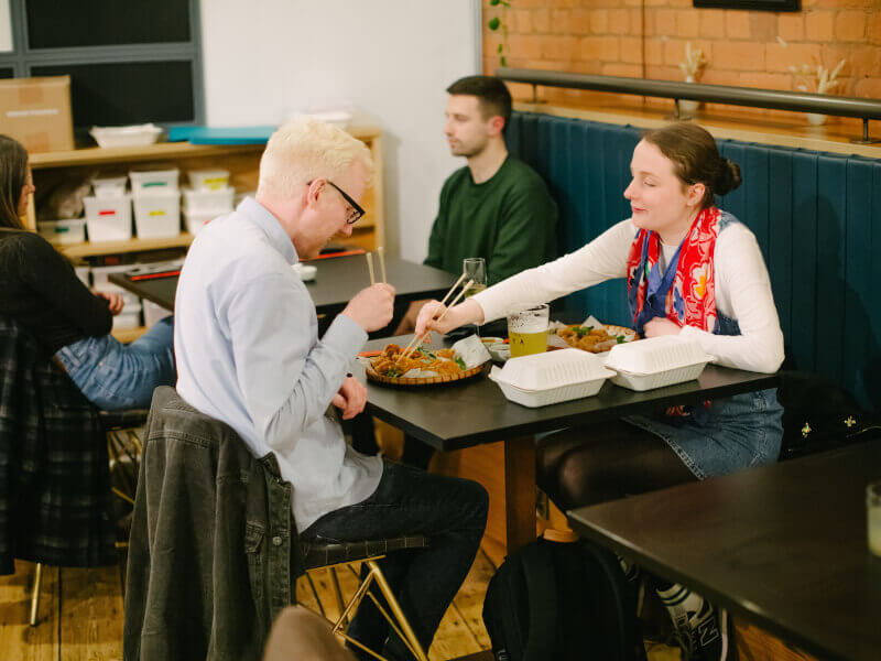 A couple eat together at a cooking class