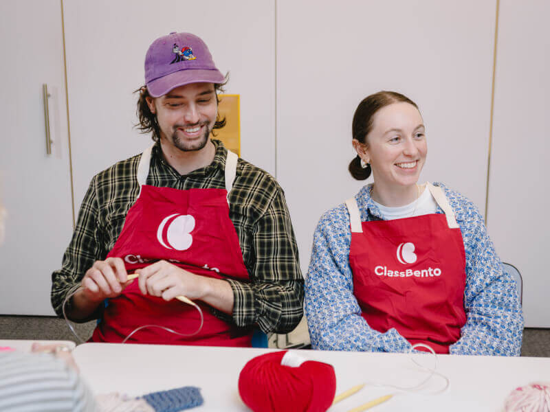 People sitting down and smiling