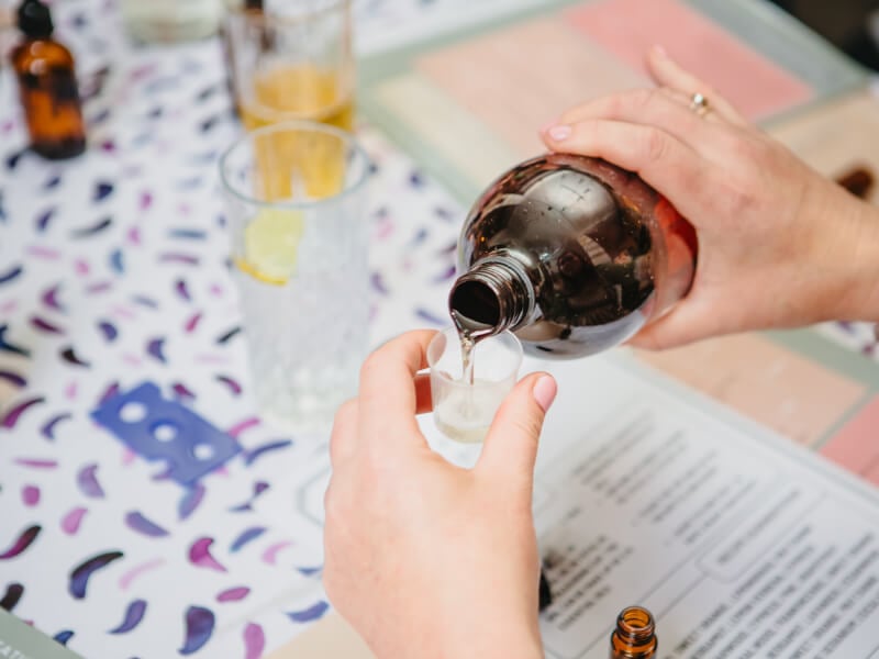 Close-up on person pouring essential oils