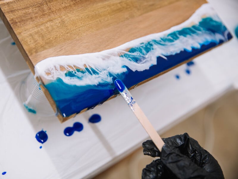 Close-up of a resin cheeseboard being made